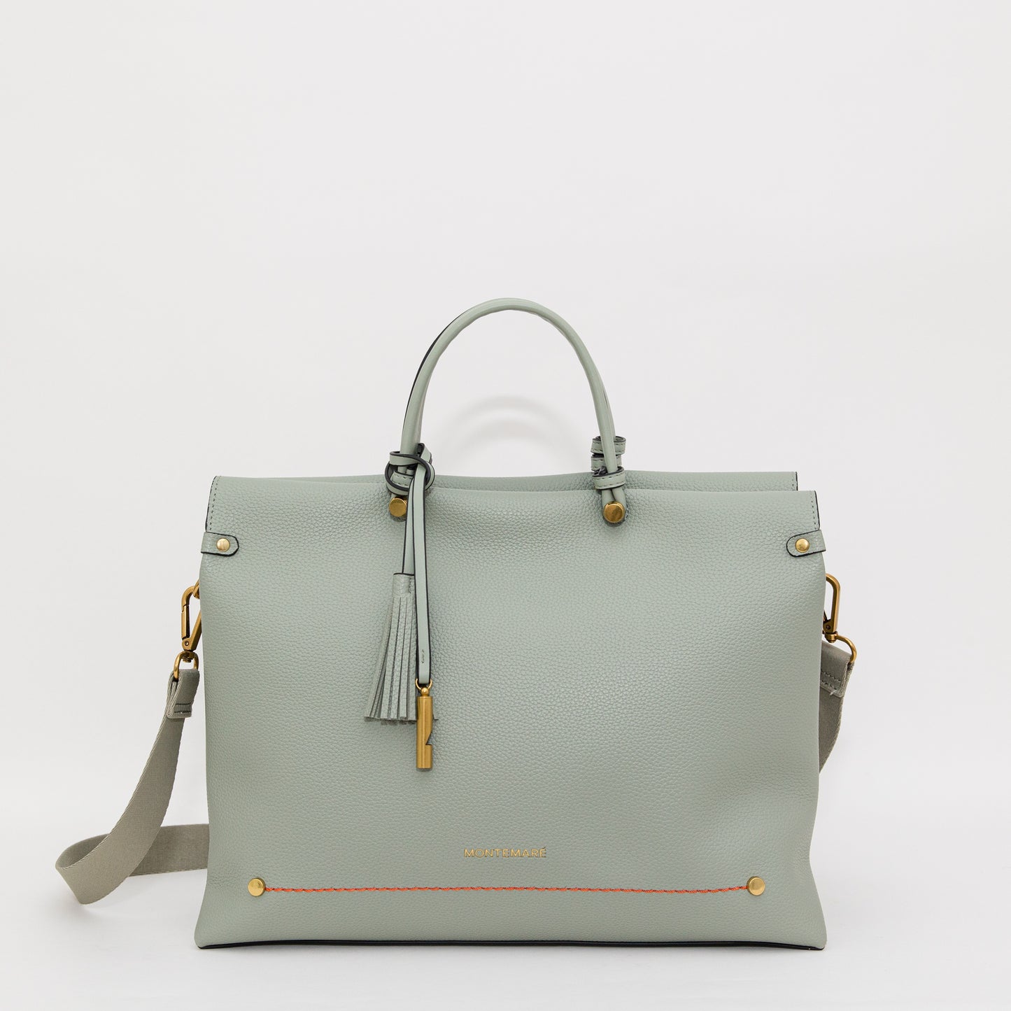 Light blue handbag with gold accents on a white background