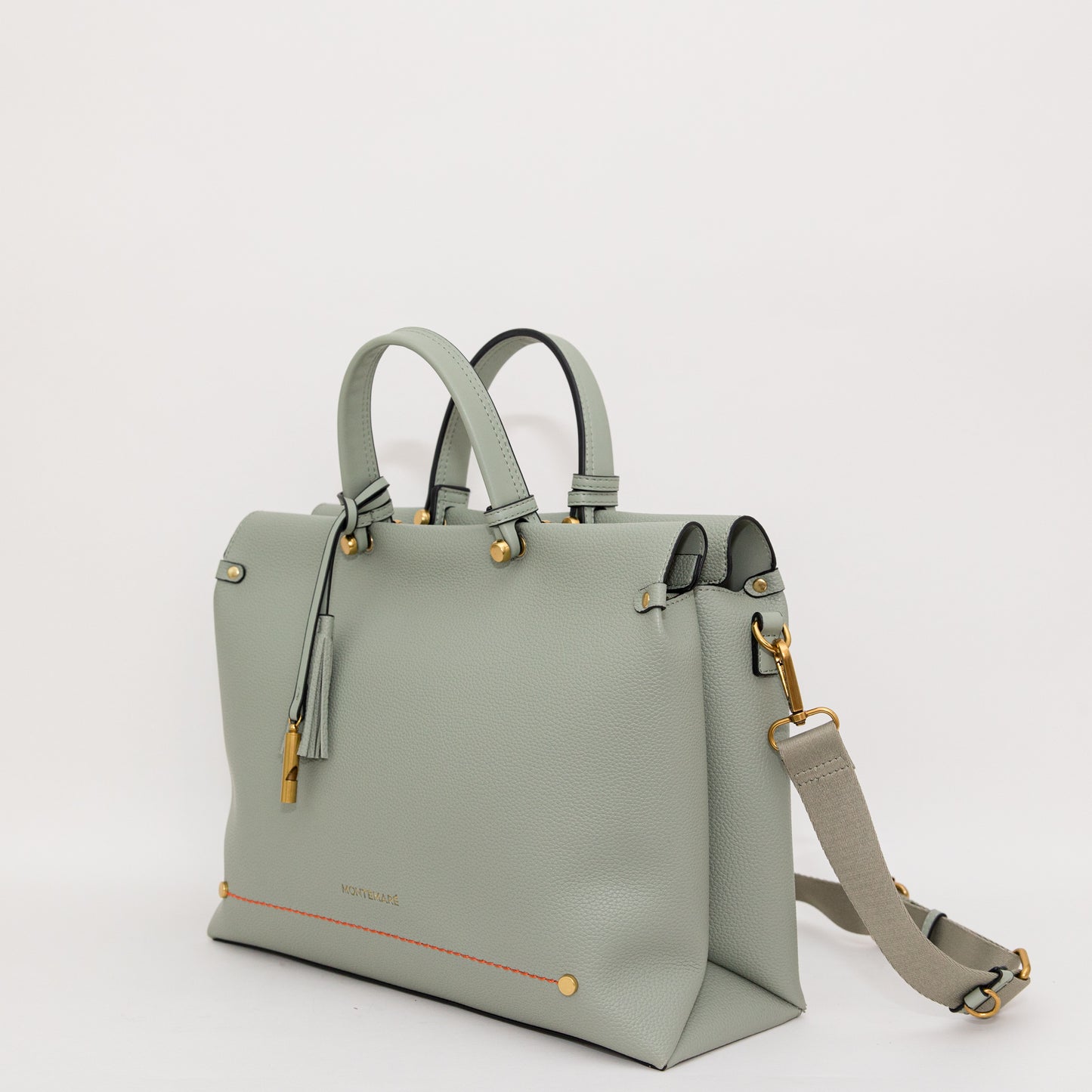 Light blue handbag with gold accents on a white background