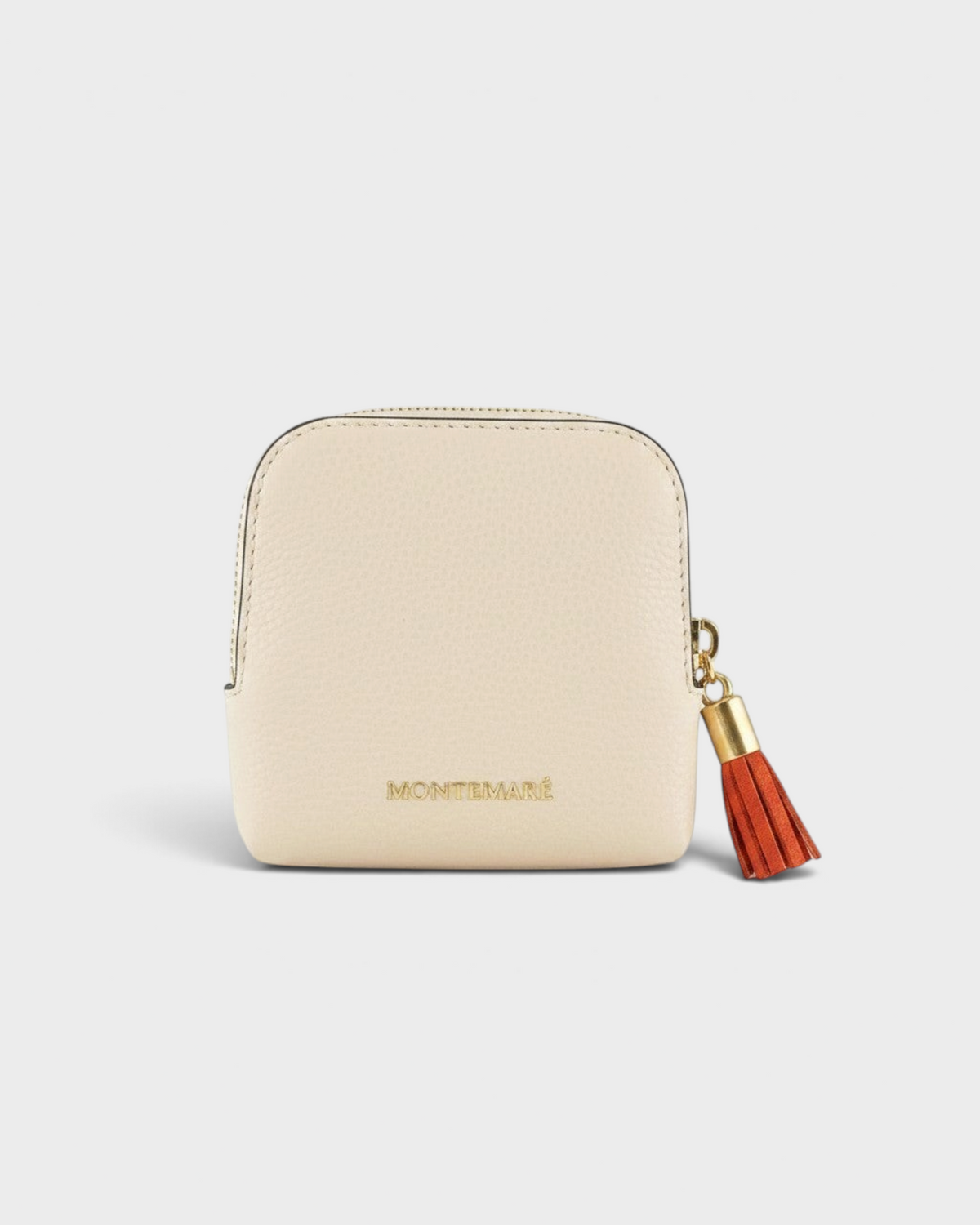 Montemaré small beige leather travel jewelry case with a gold zipper and decorative orange tassel