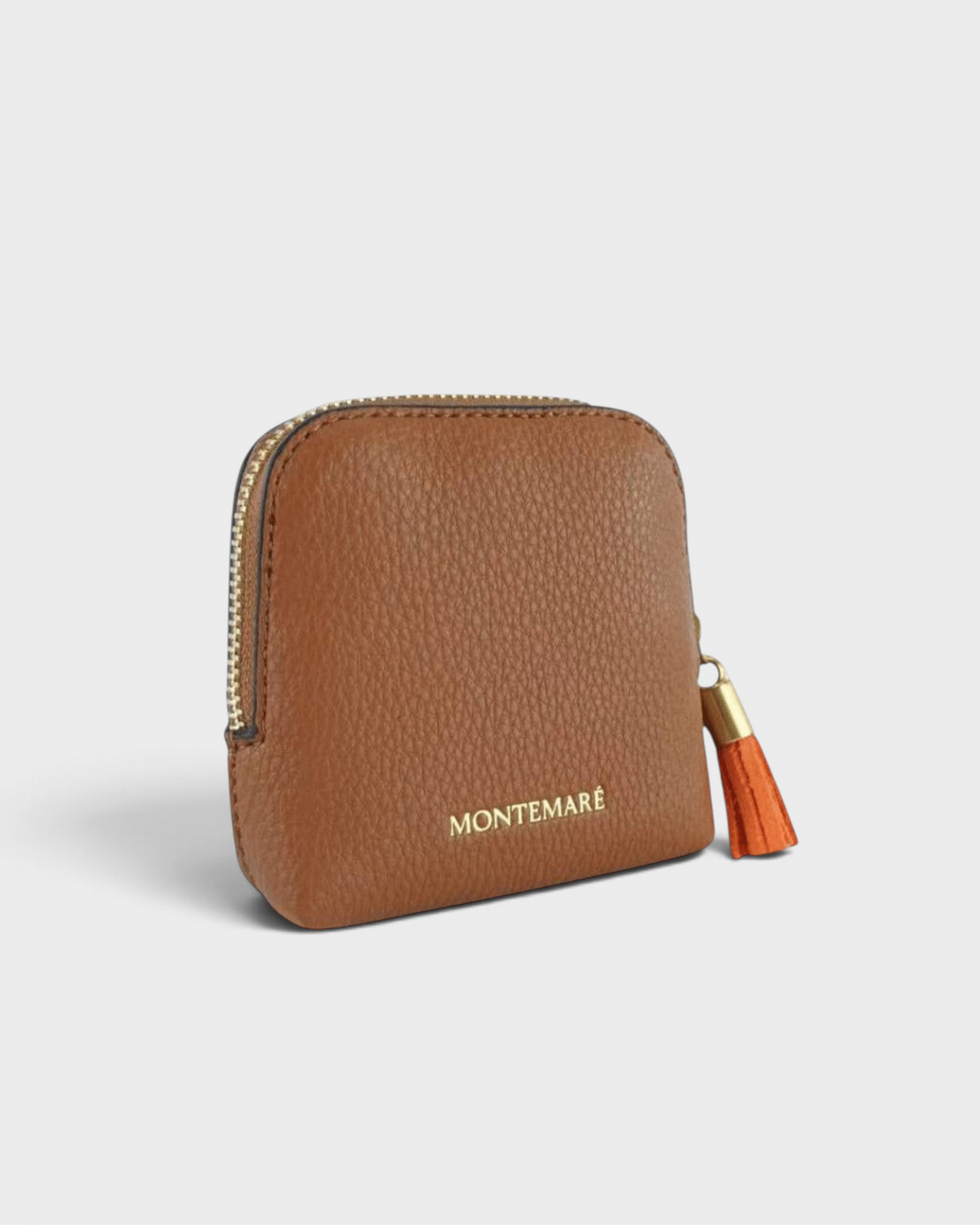 Montemaré small brown pebble-grain leather travel jewelry case with a gold zipper and orange tassel accent.