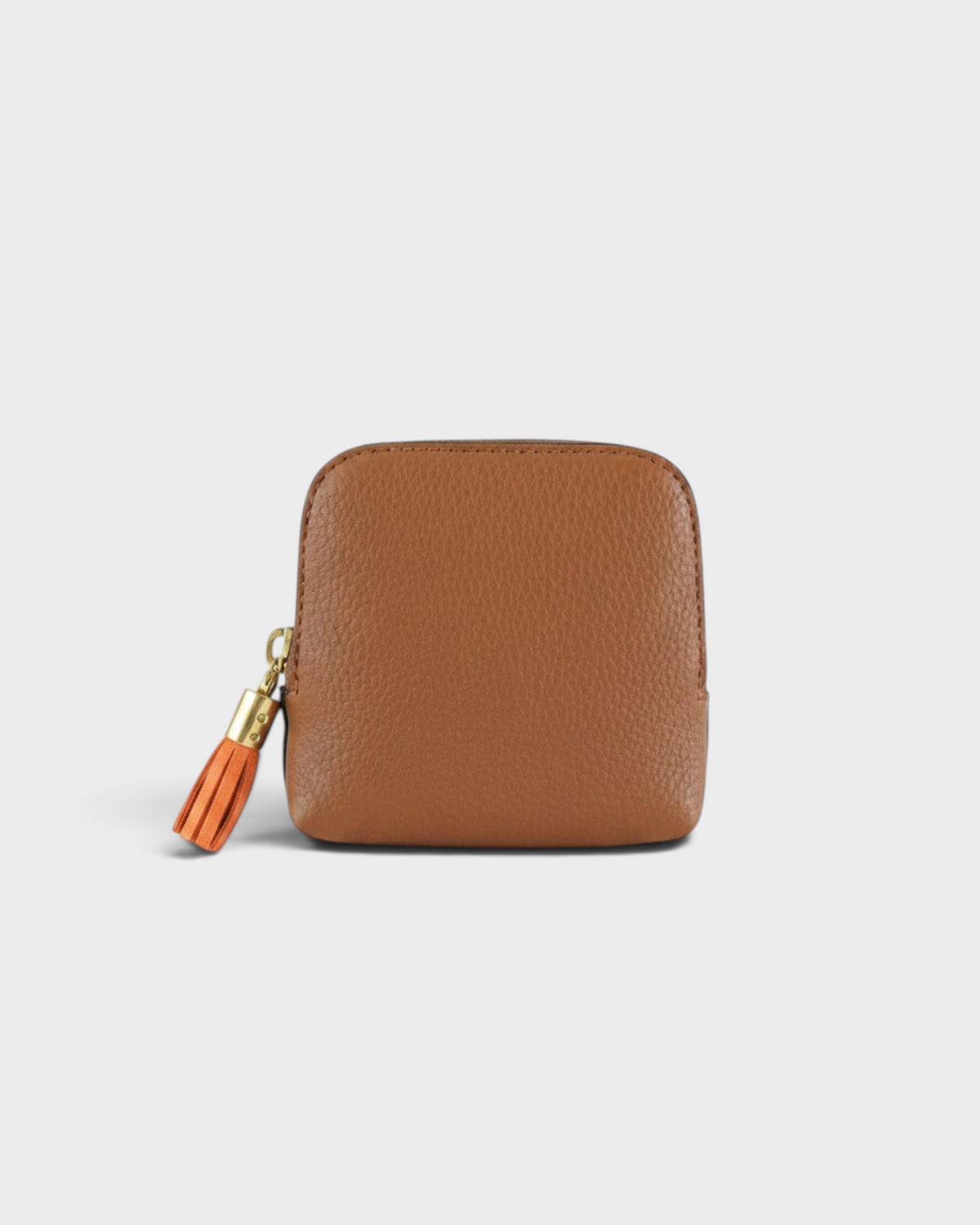 Montemaré small brown leather travel jewelry case with a decorative orange tassel zipper pull
