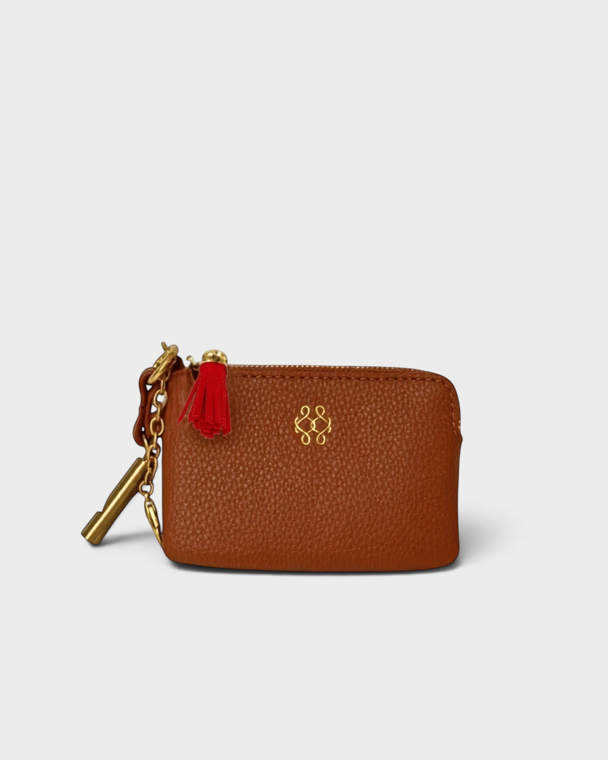 Montemaré brown vegan leather RFID card case with a gold logo, zipper closure, and signature orange whistle tassel.