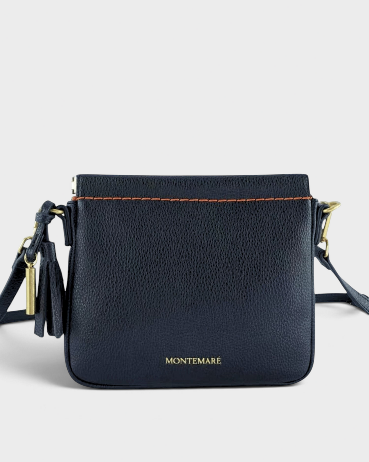 Montemaré square black leather crossbody pouch with contrast orange stitching and gold hardware details.