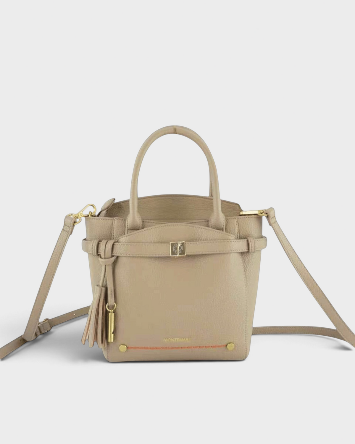 Montemaré Mayfair tall crossbody bag in beige pebbled leather with gold hardware, top handles, and a tassel detail.