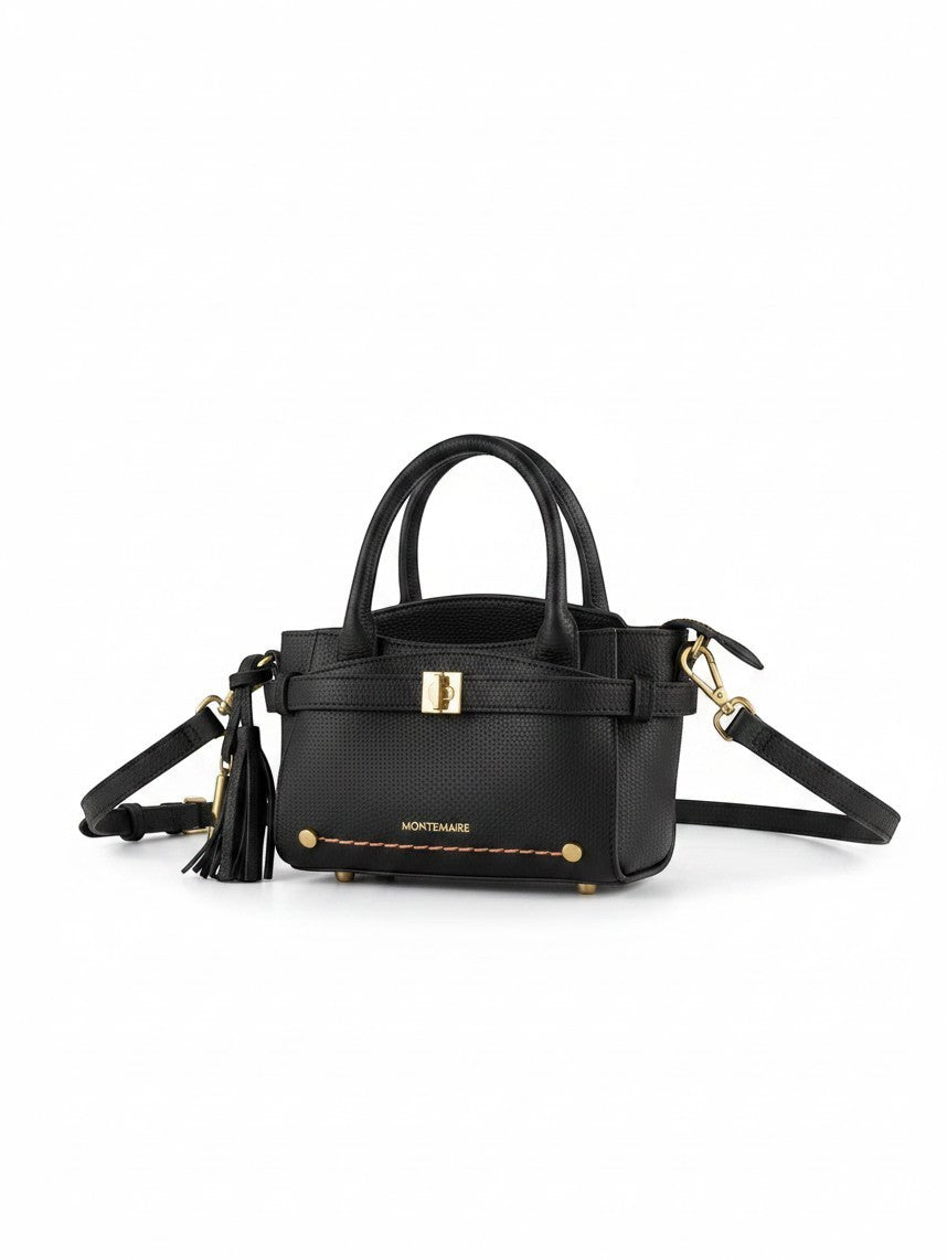 Montemaré Mayfair Mini Crossbody bag in black textured leather with gold hardware, top handles, and tassel detail.