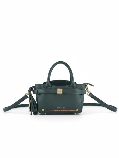 Montemaré Mayfair Mini Crossbody bag in dark green pebbled leather with gold hardware and a decorative tassel.