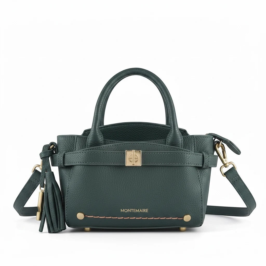 Montemaré Mayfair Mini Crossbody bag in dark green pebbled leather with gold hardware and a decorative tassel.