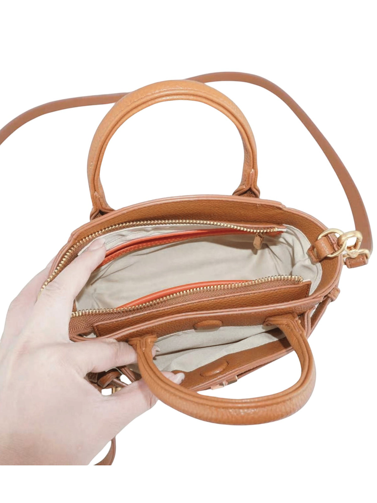 Montemaré Mayfair Mini Crossbody bag in tan leather with top handles and an open interior view