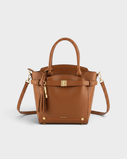 Montemaré Mayfair Tall Crossbody bag in tan pebbled leather with gold hardware, top handles, and a tassel detail.