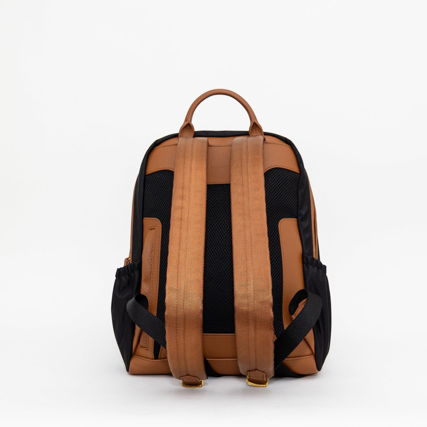 Back view of the Montemaré Oslo backpack in black nylon and tan leather with padded shoulder straps and mesh back panel.