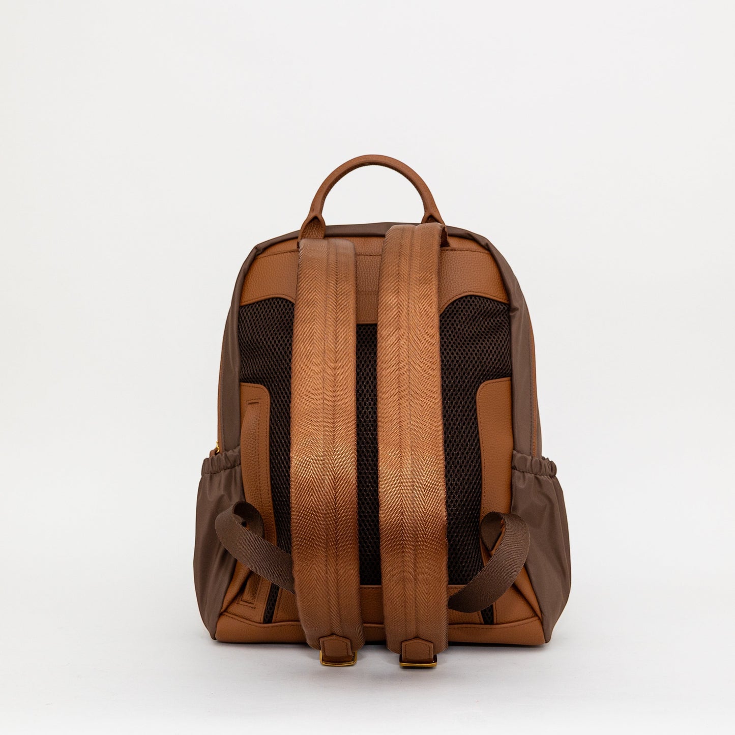 Montemaré Oslo backpack in brown nylon and leather, showing the back view with padded straps and mesh back panel.
