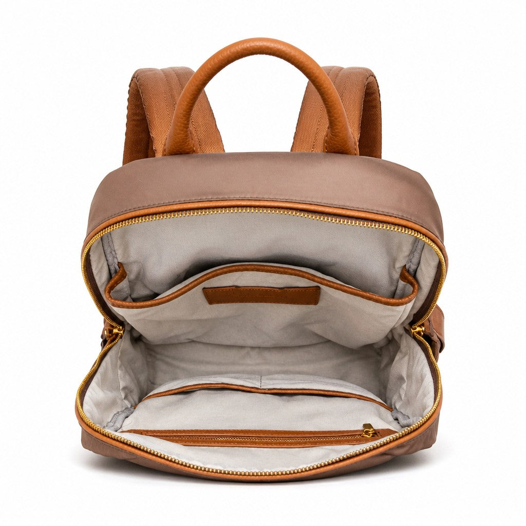 Montemaré Oslo backpack interior view showing cotton lining, leather trim, and organizational pockets.