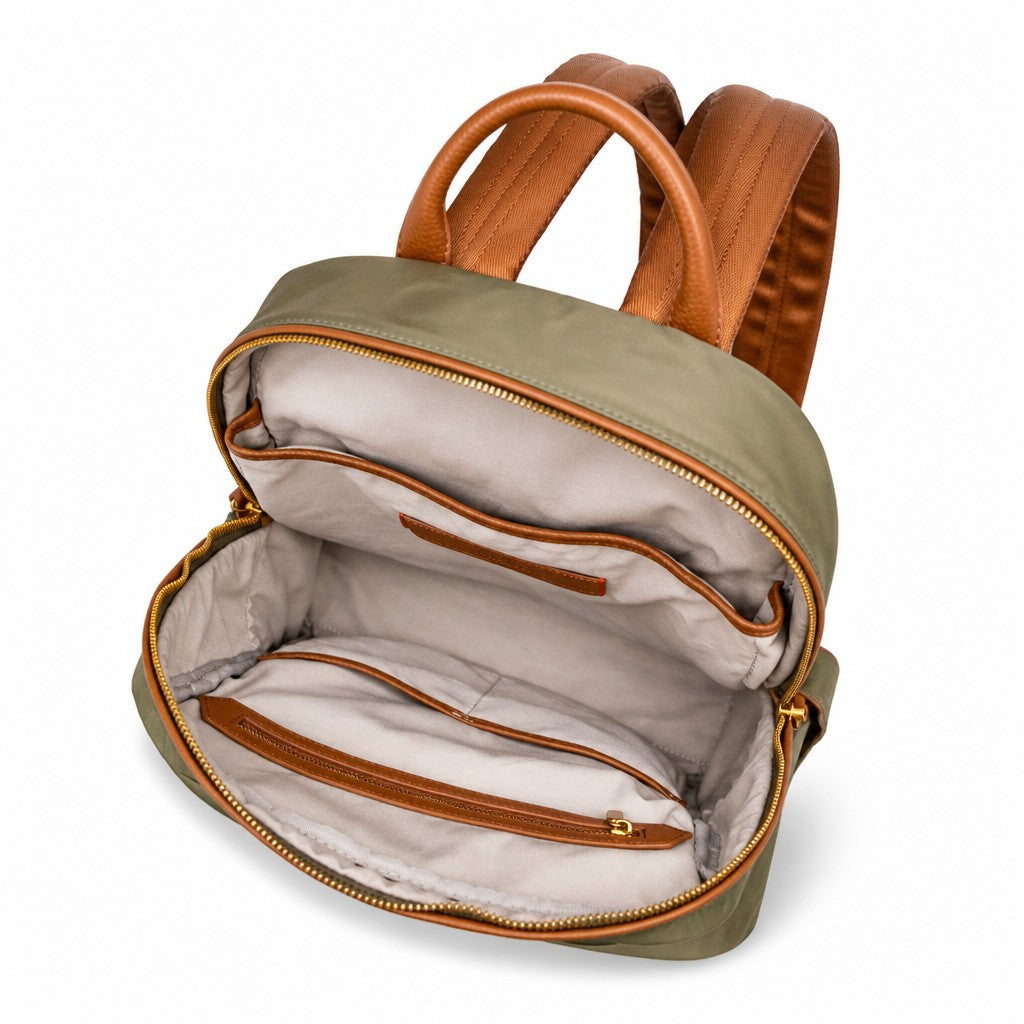 Montemaré Oslo backpack in olive green nylon and brown leather with an open interior showing organized compartments.