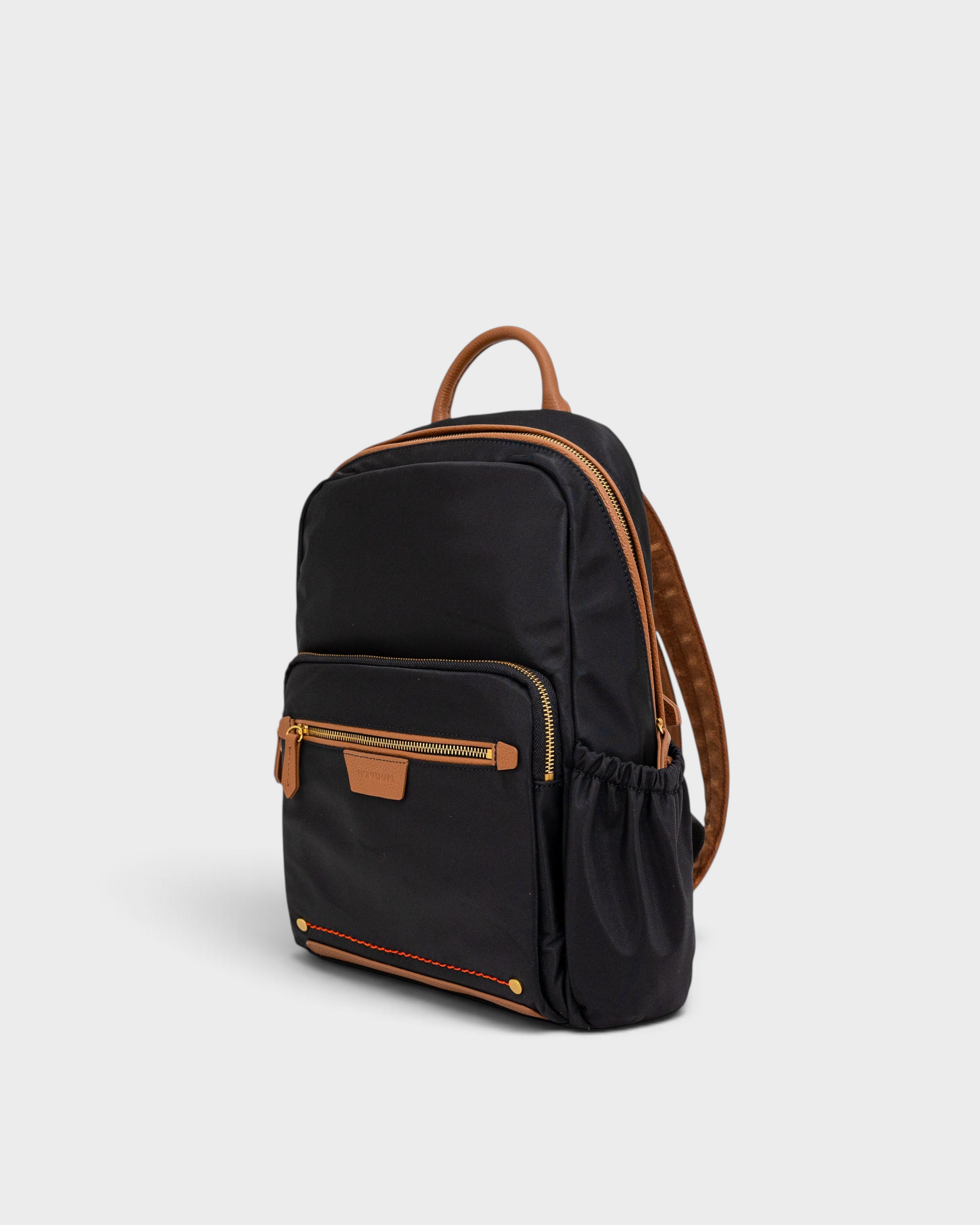 Montemaré Oslo premium black nylon and leather backpack with gold zippers and side pockets on a white background