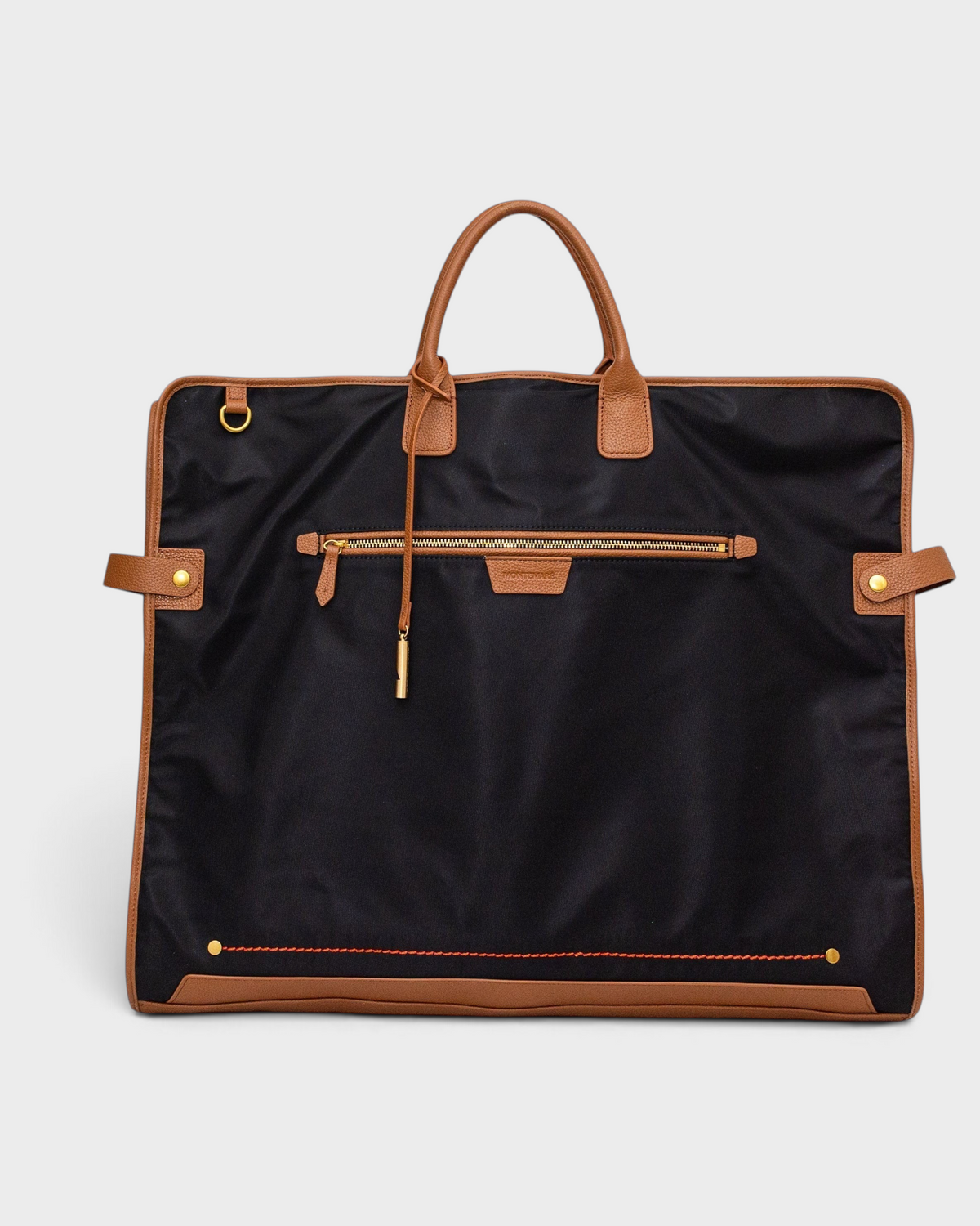 Montemaré Oslo premium black waterproof nylon garment bag with brown leather trim, top handle, and front zipper pocket.