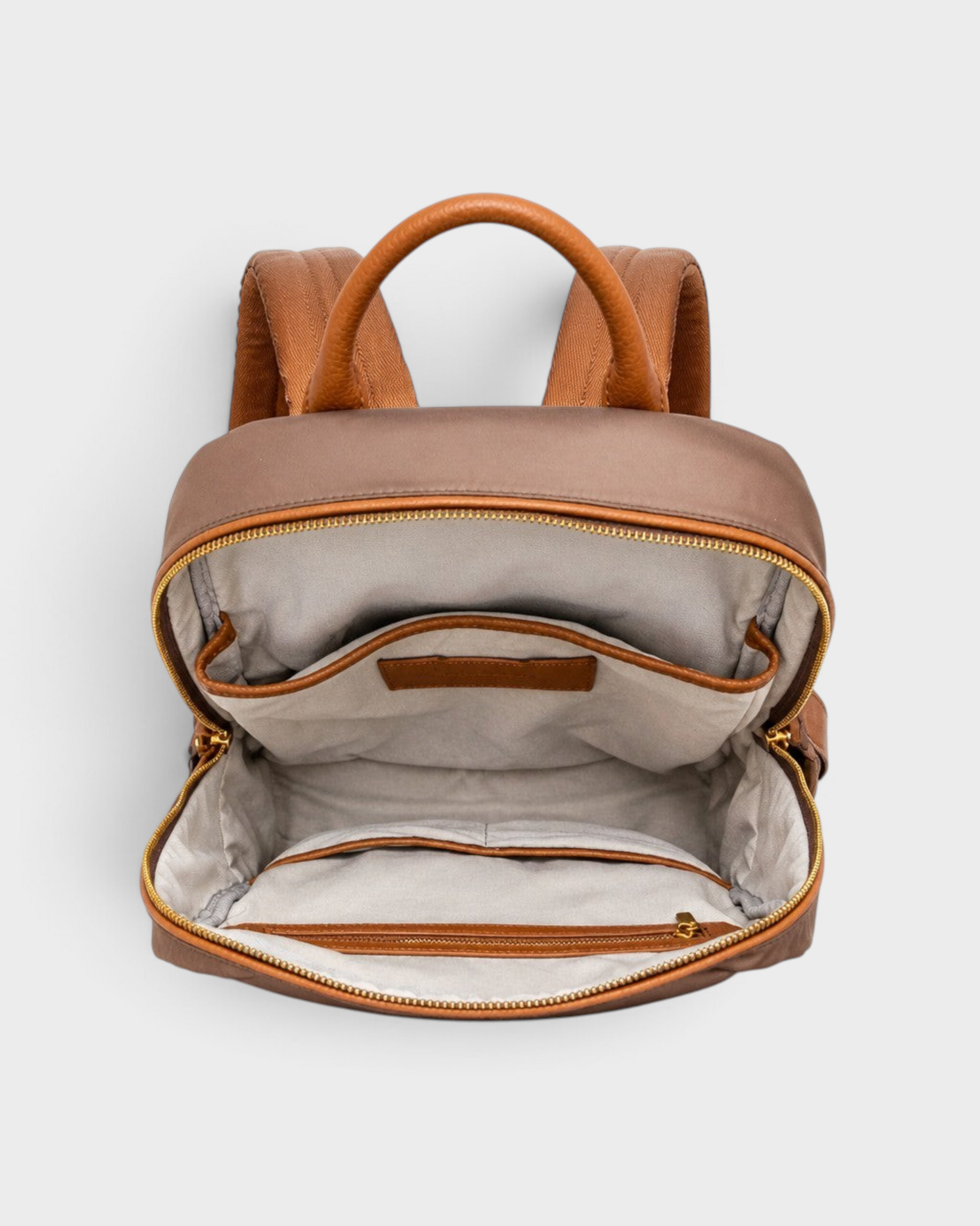 Montemaré Oslo premium brown nylon and leather backpack with open interior showing pockets and cotton lining