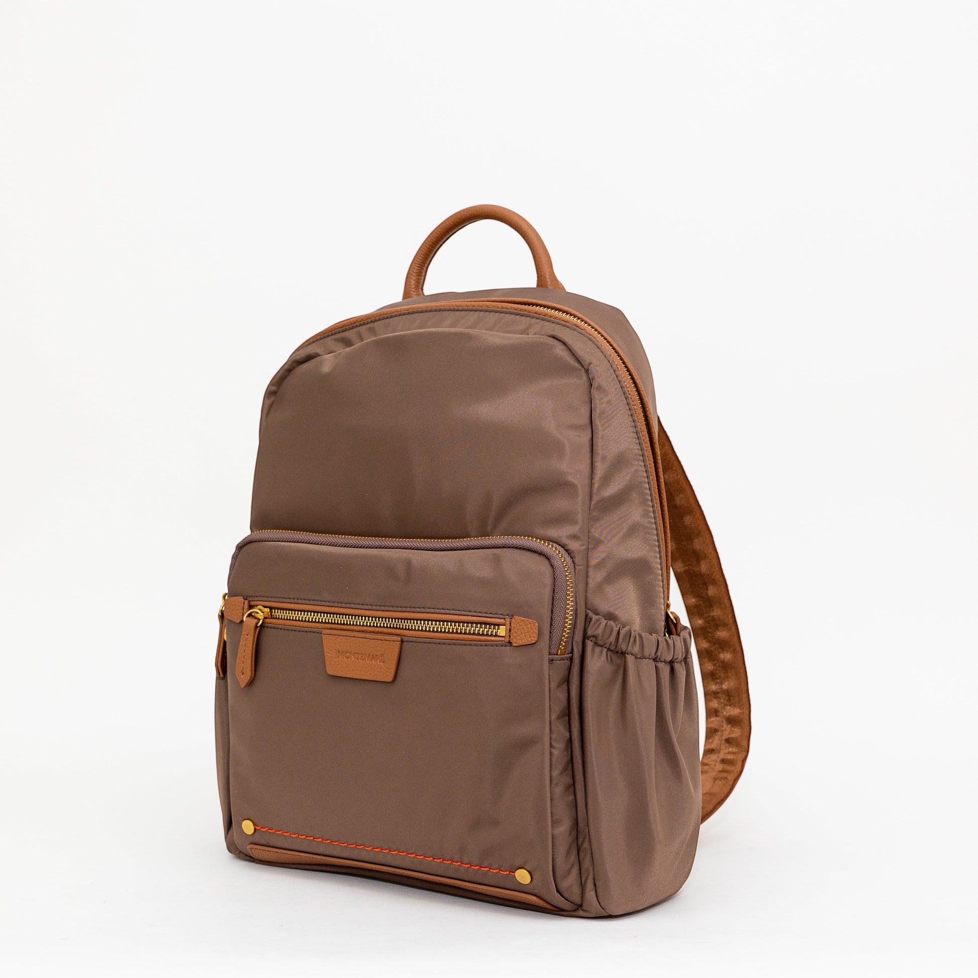 Montemaré Oslo backpack in brown waterproof nylon with genuine leather trim, featuring gold zippers and side pockets.