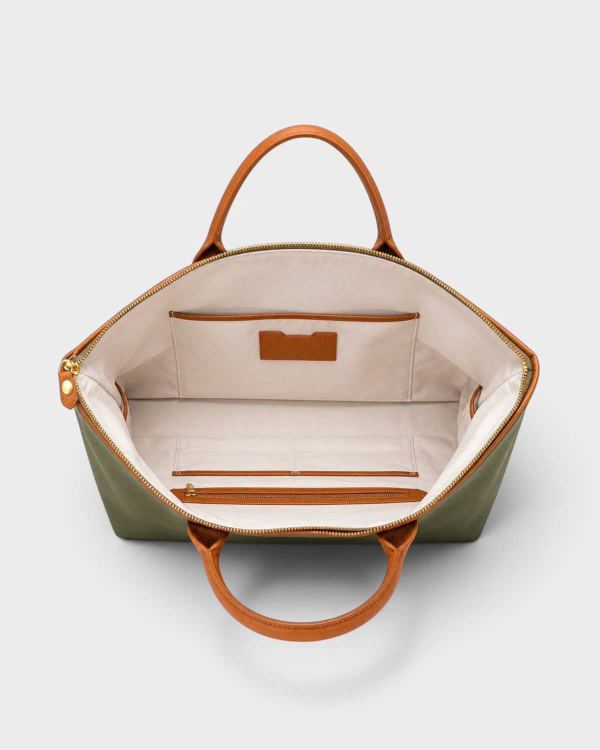Montemaré Oslo carry-on bag interior view showing cotton lining, leather trim, and organizational pockets.