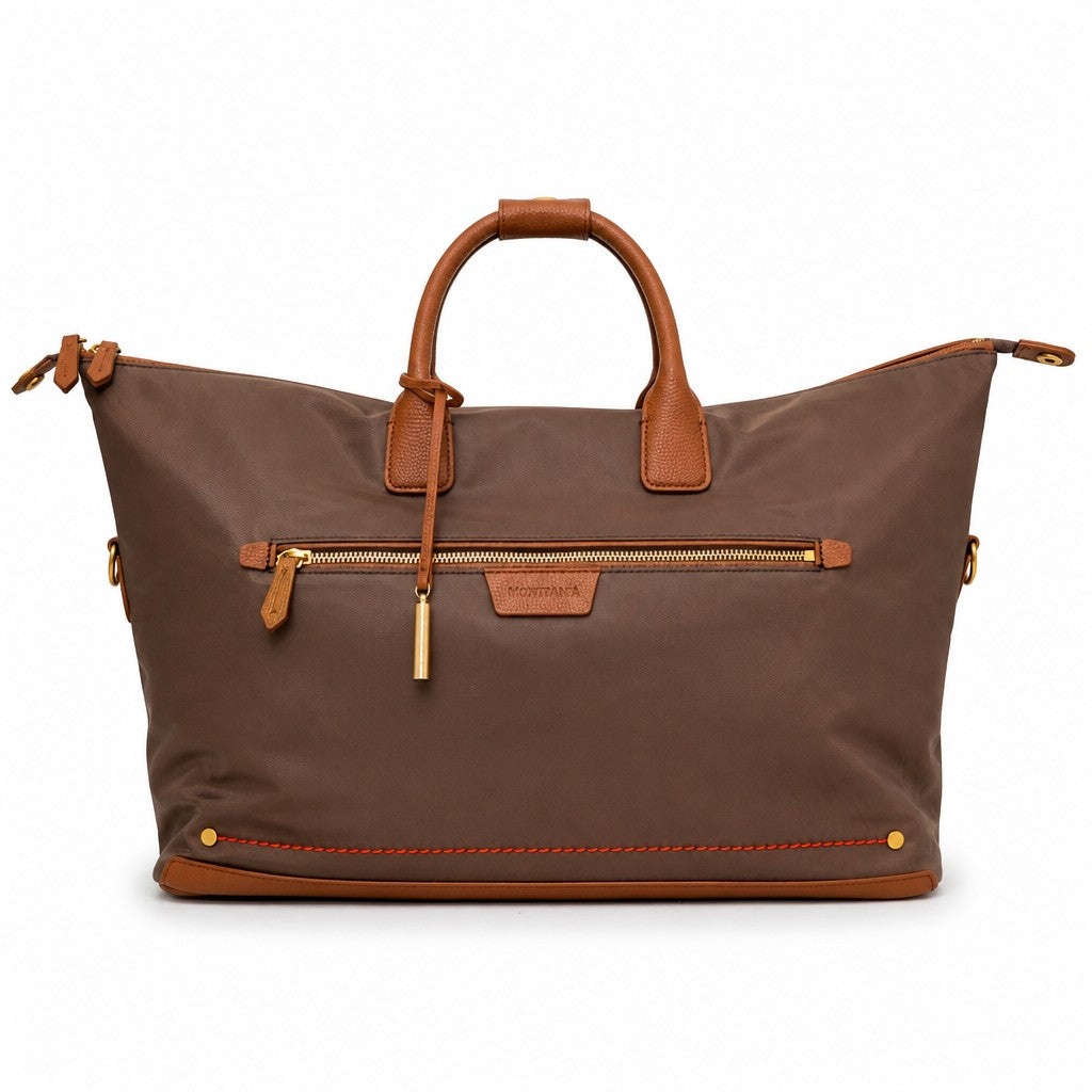 Montemaré Oslo Carry On weekender bag in brown waterproof nylon with genuine leather trim and gold hardware.
