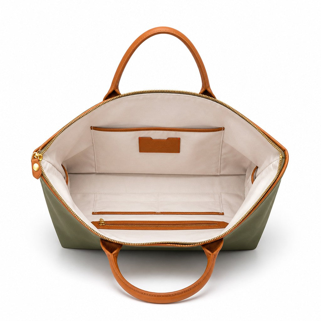 Montemaré Oslo Carry-On weekender bag interior view showing cream cotton lining, leather trim, and organizational pockets