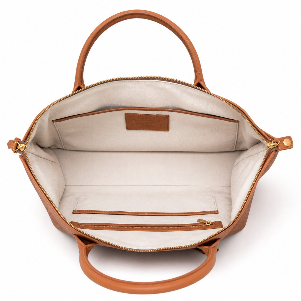 Interior view of Montemaré Oslo Carry On weekender bag featuring a light cotton lining and leather trim details.