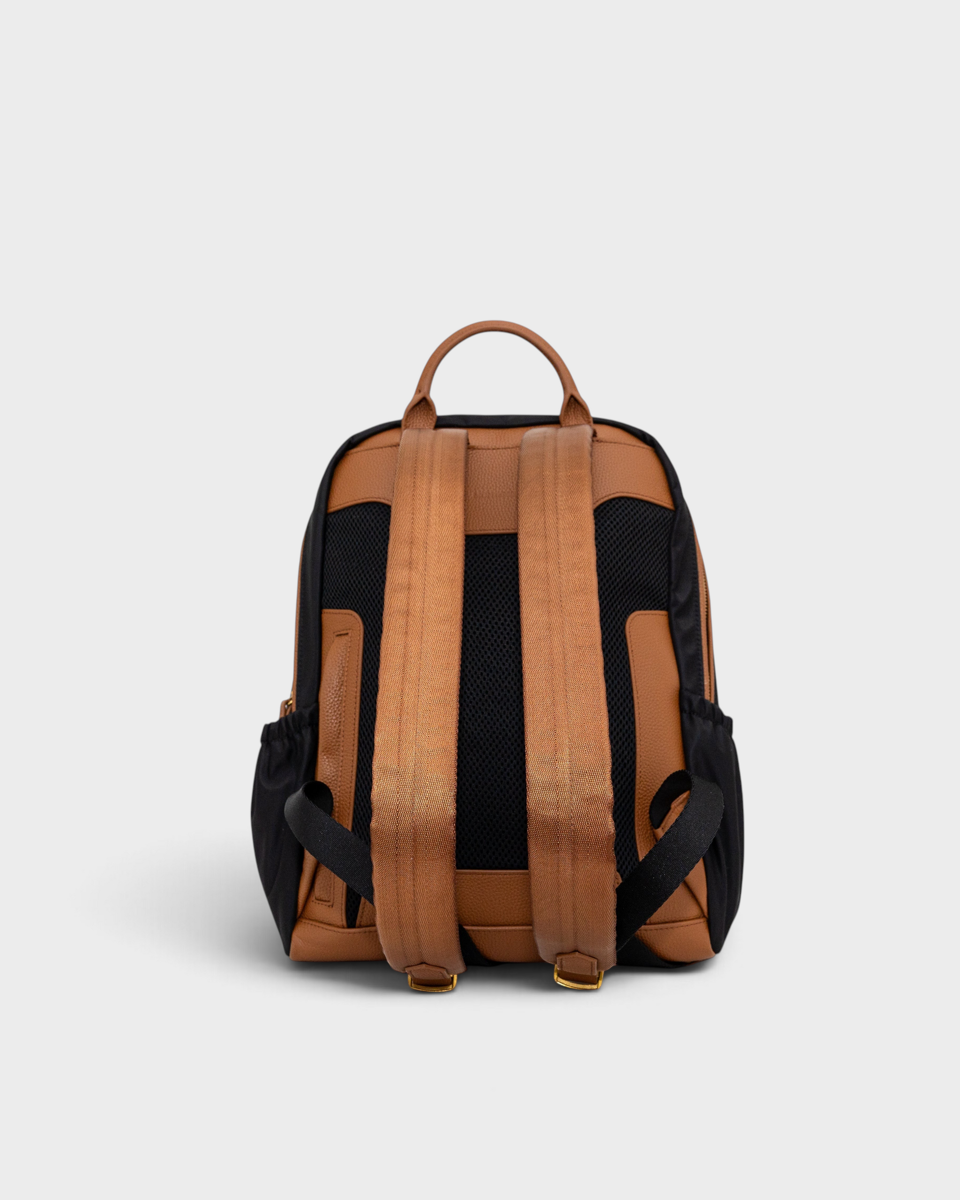Montemaré Oslo premium RFID-blocking backpack in black nylon and tan leather, showing the padded back and straps.