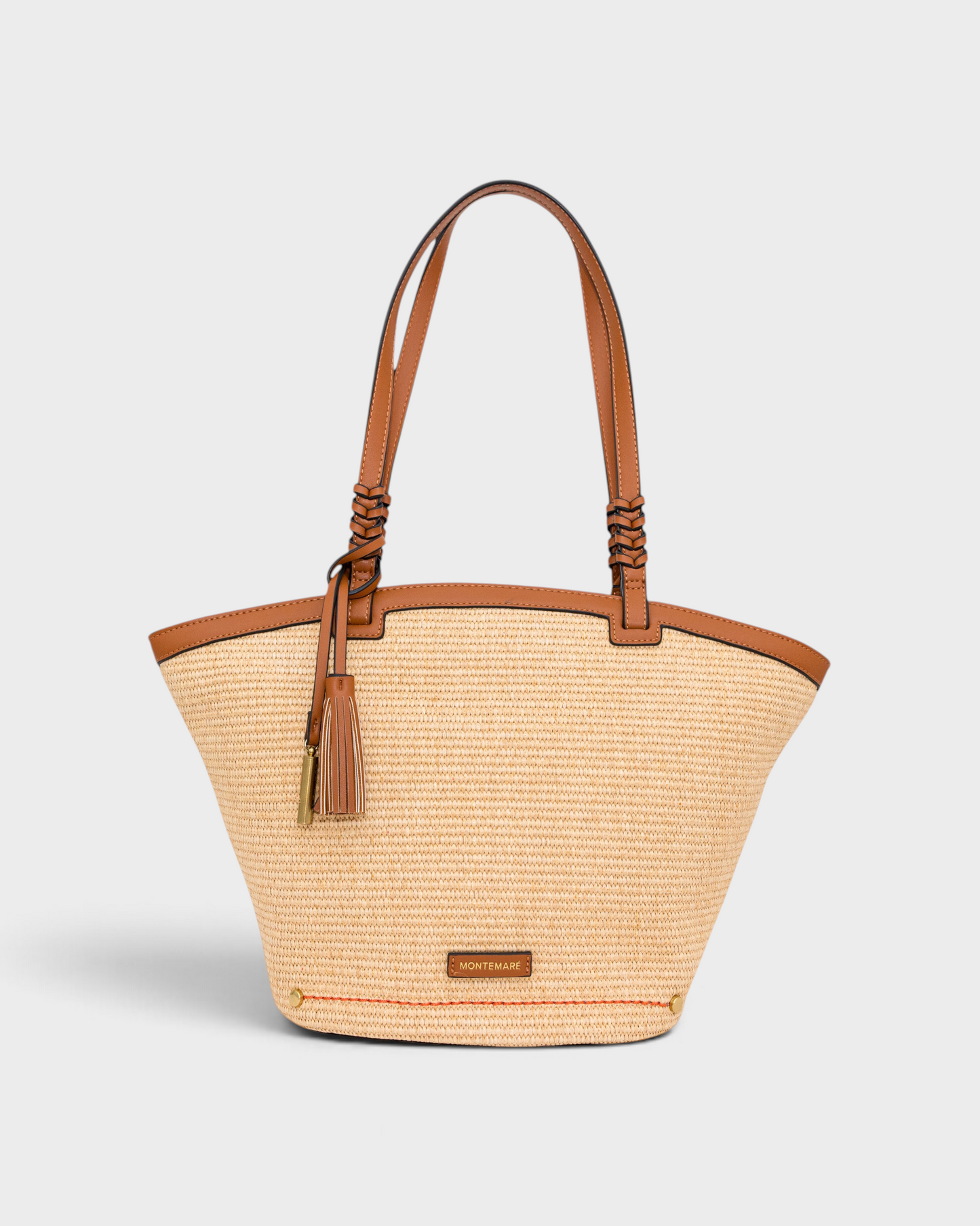 Montemaré Palma straw-style tote bag with tan vegan leather trim, braided handles, and a signature whistle tassel.