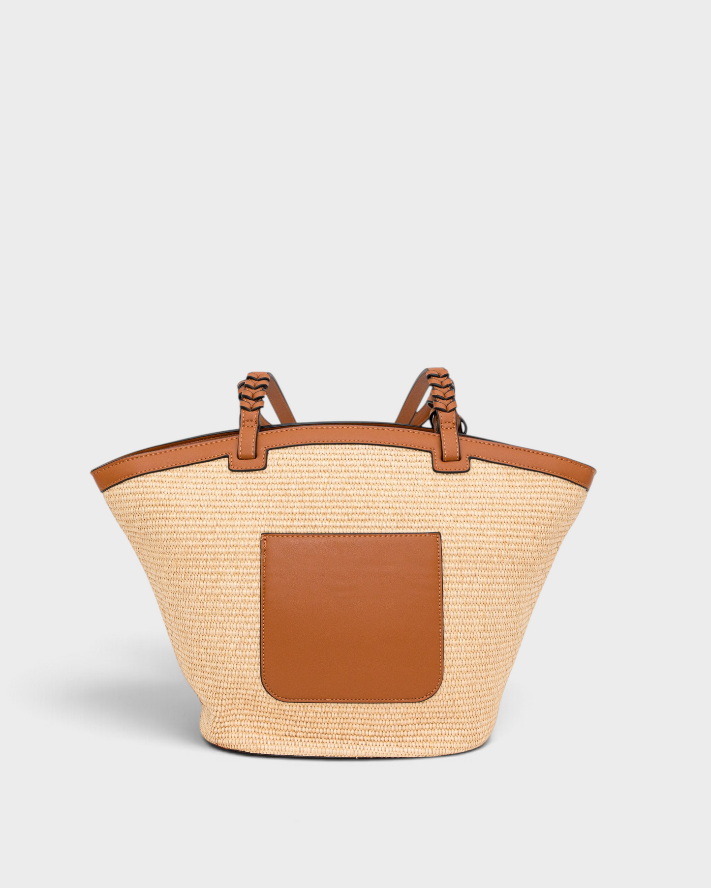 Montemaré Palma straw-style tote bag with tan vegan leather trim, braided handles, and an exterior back pocket.