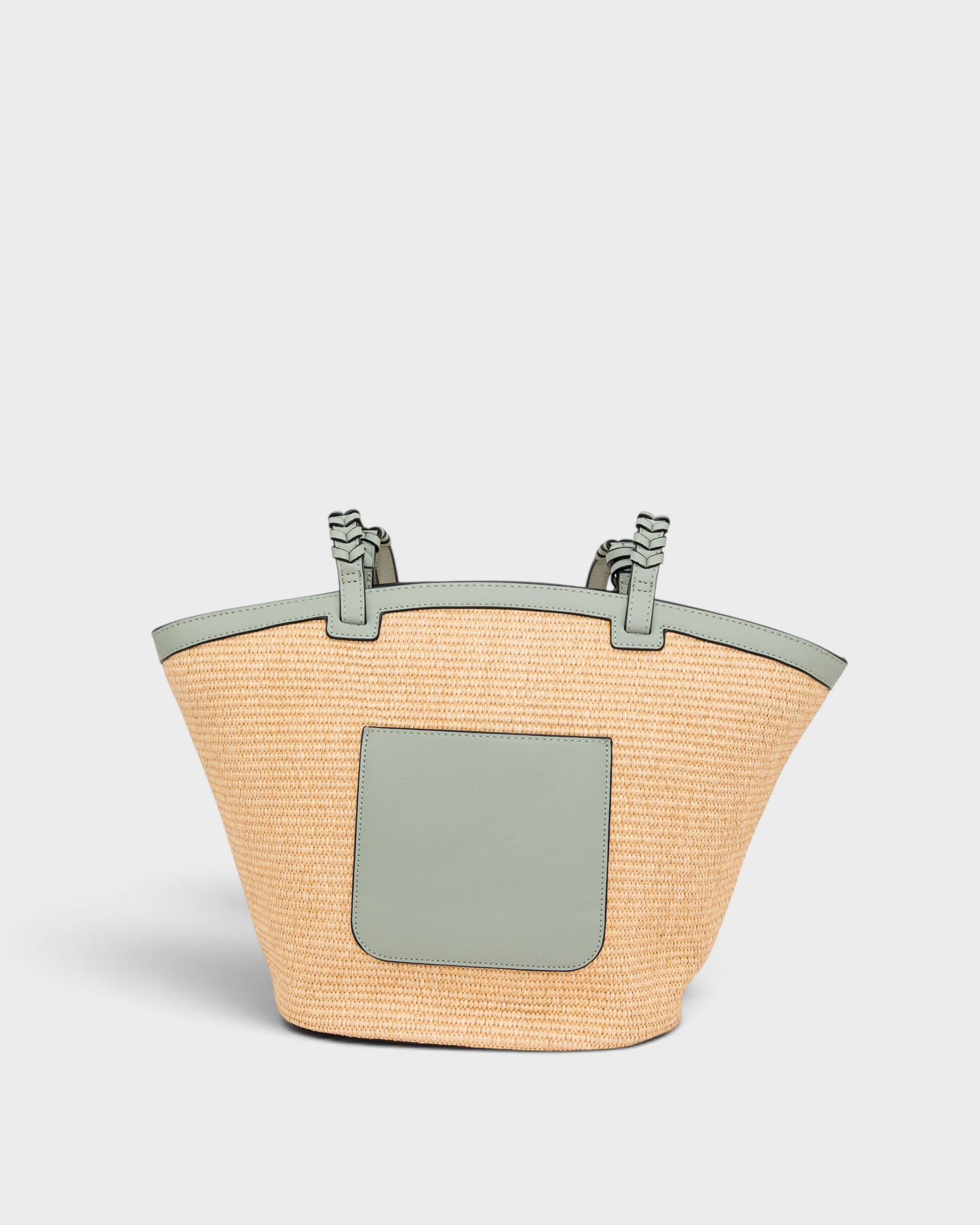 Montemaré Palma Tote in straw-like material with sage green vegan leather trim, shoulder straps, and back pocket.