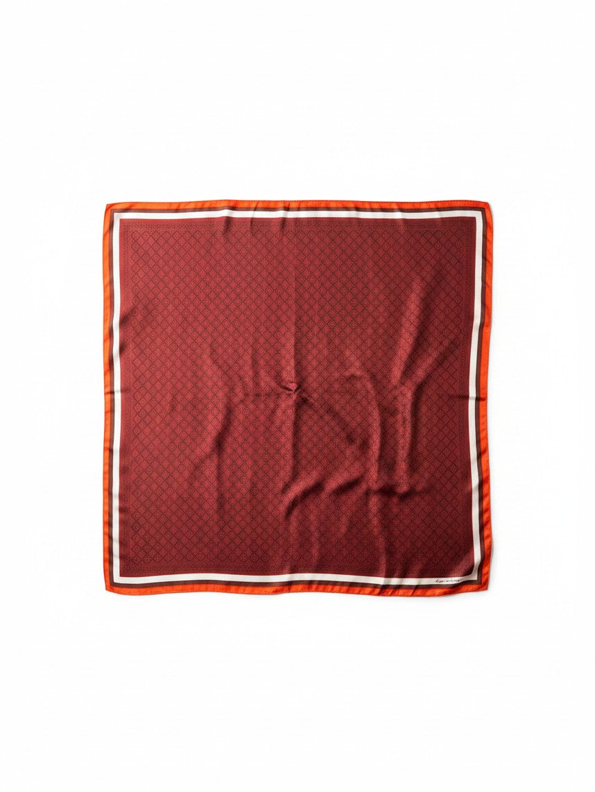 Montemaré original square silk scarf in deep red with a geometric pattern and orange and white border