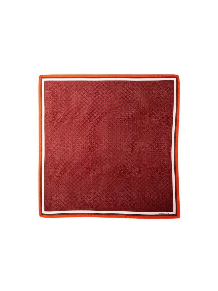 Montemaré Original silk square scarf in deep red with a geometric pattern and vibrant orange border.