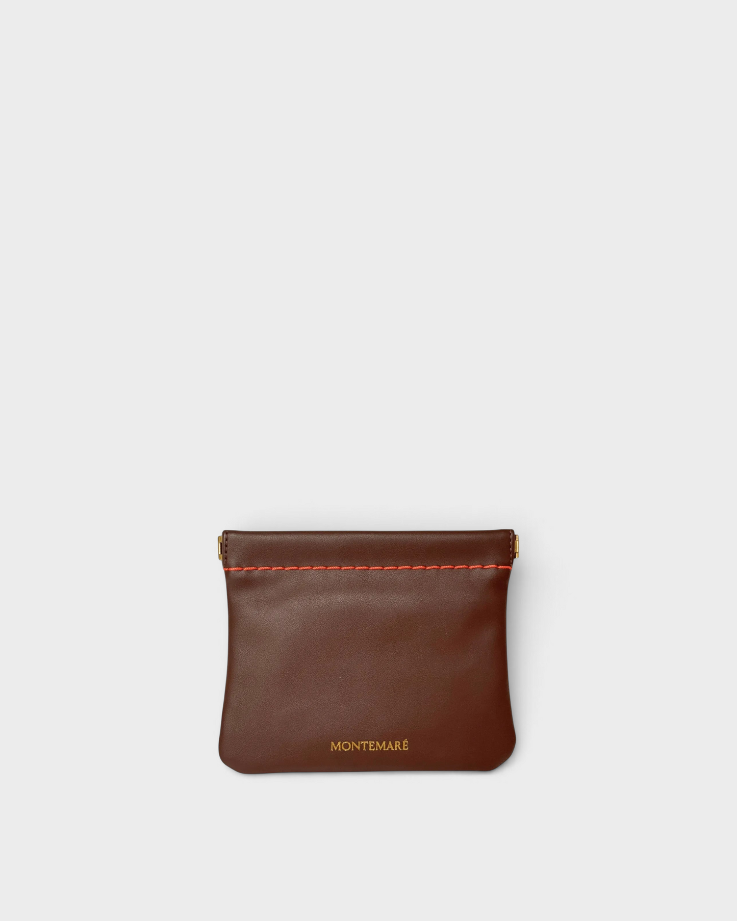 Montemaré Roma square pouch in brown vegan leather with a spring-frame closure and orange contrast stitching.