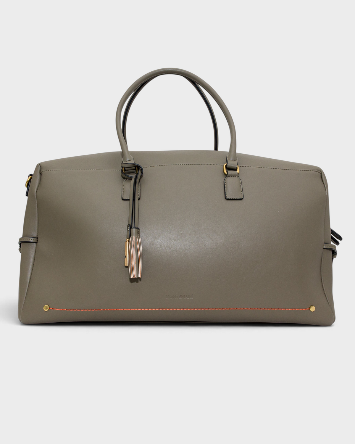 Montemaré Roma Duffel in grey vegan leather with top handles, metal feet, and a decorative safety whistle tassel.