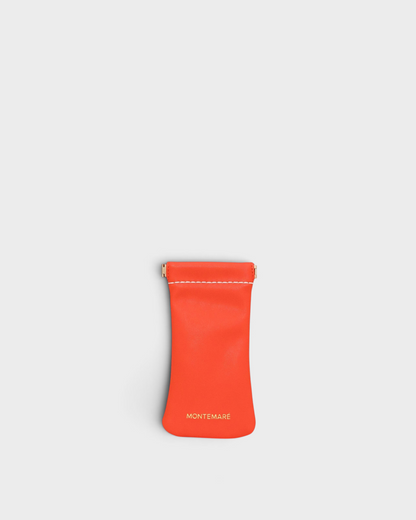 Montemaré Roma glasses case in vibrant orange vegan leather with a convenient spring-frame closure.