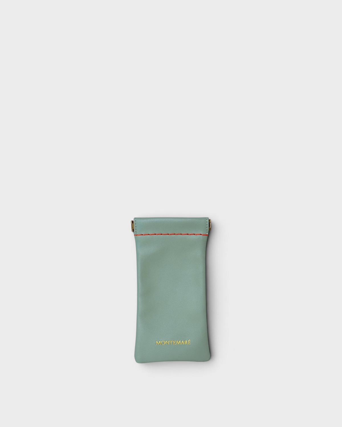 Montemaré Roma glasses case in sage green vegan leather with a spring frame closure and contrast stitching.