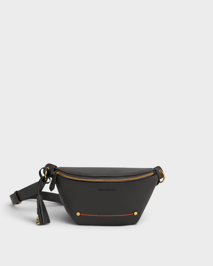 Montemaré Roma Sling bag in black vegan leather with gold hardware, zip closure, and signature safety whistle tassel.