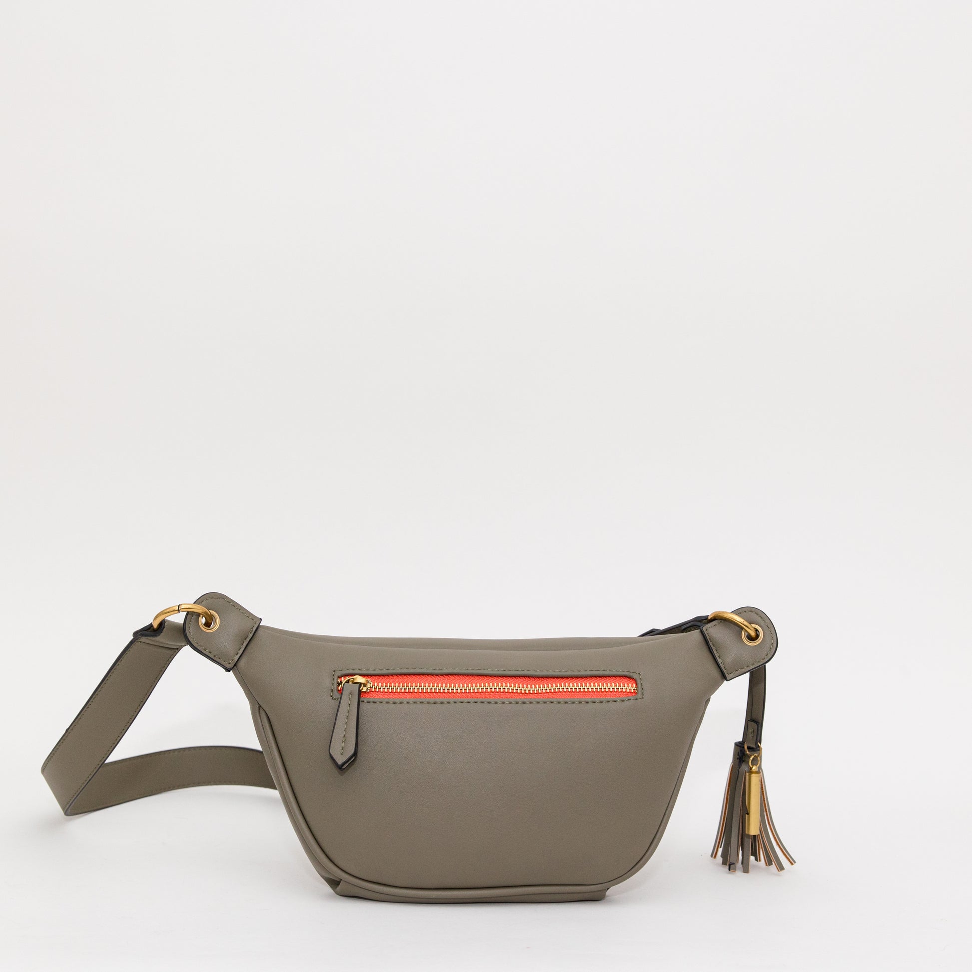Back of an olive green sling featuring a bright orange zipper patch, brass-finished zipper and whistle tassel on white background.
