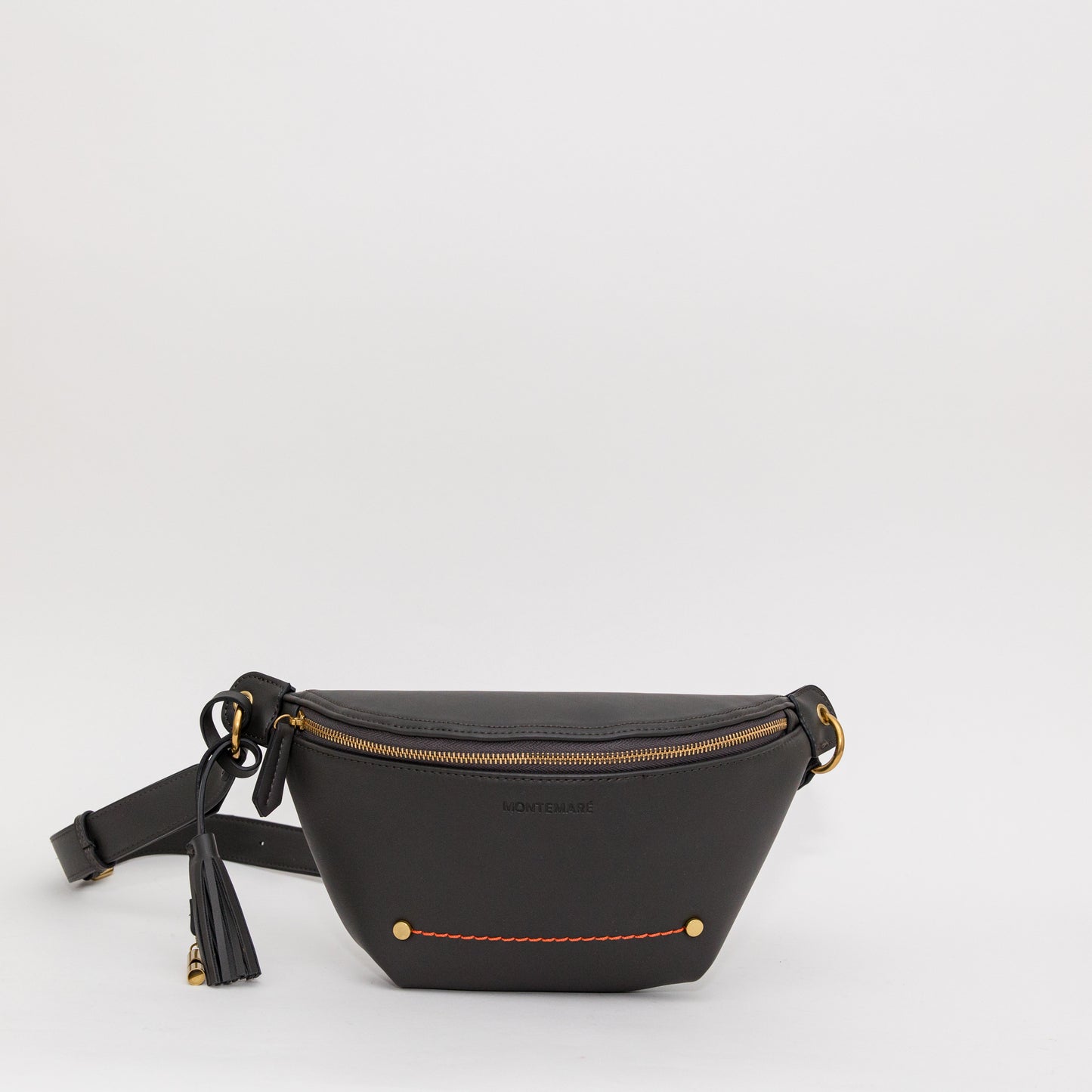 Soft black sling with gold-finished zipper, whistle tassel, and orange stitching on a white background
