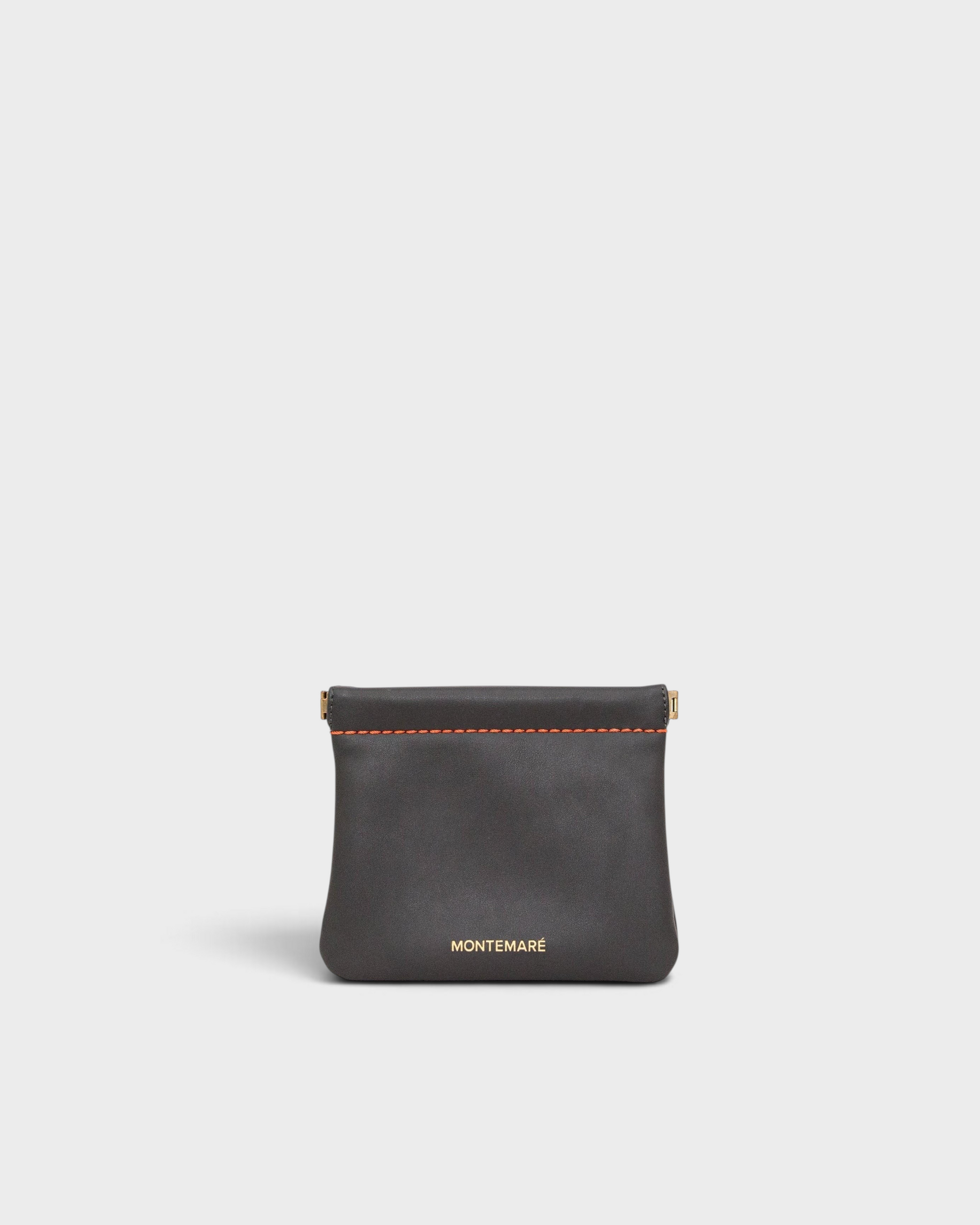 Montemaré Roma square pouch in dark grey vegan leather with orange contrast stitching and spring-frame closure.