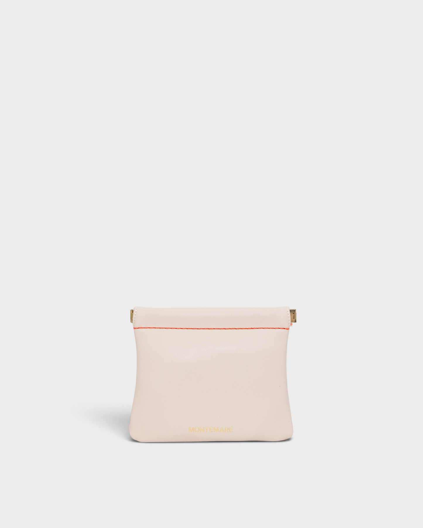 Montemaré Roma square pouch in light pink vegan leather with a secure spring-frame closure and gold logo detail.