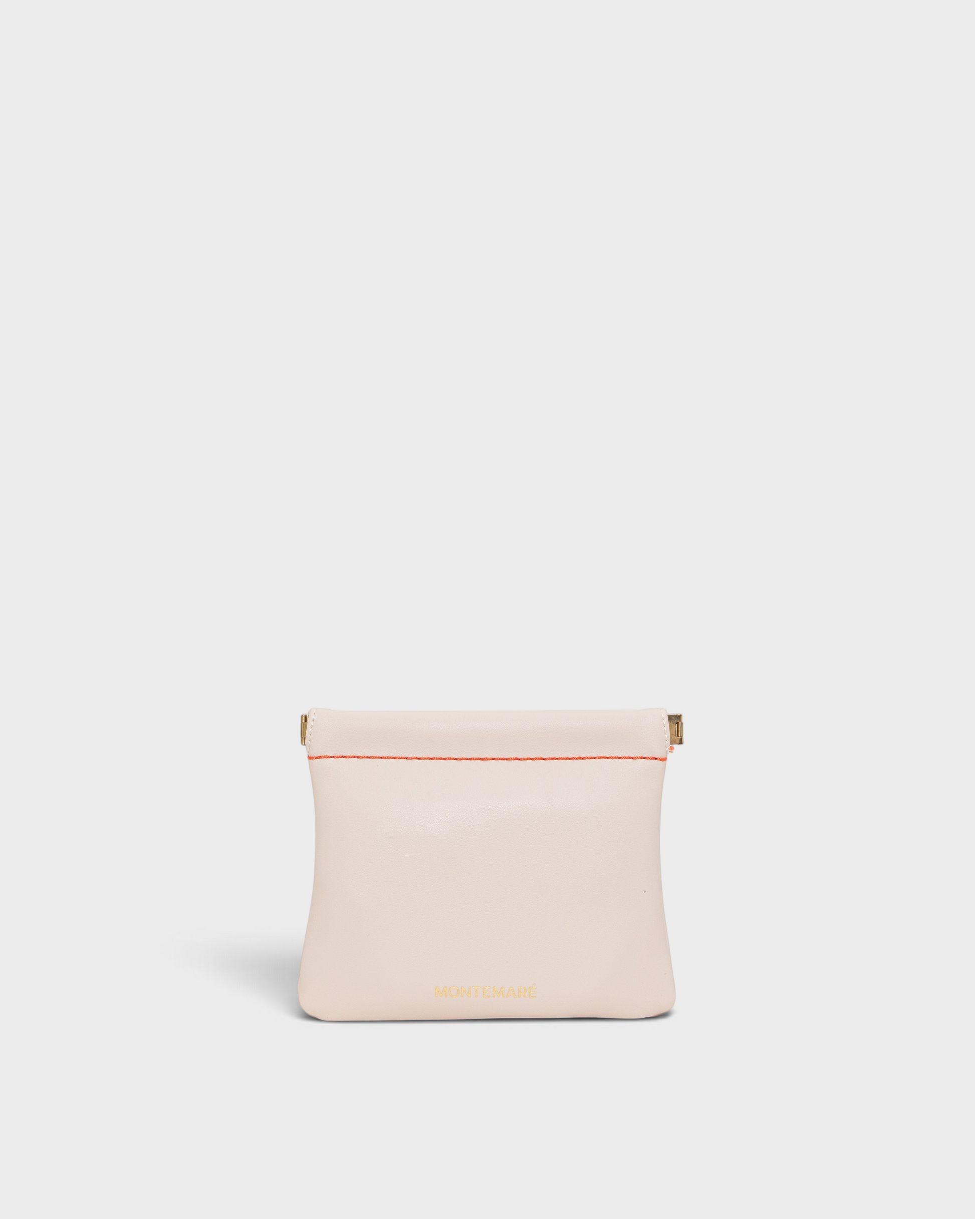 Montemaré Roma square pouch in light pink vegan leather with a secure spring-frame closure and gold logo detail.
