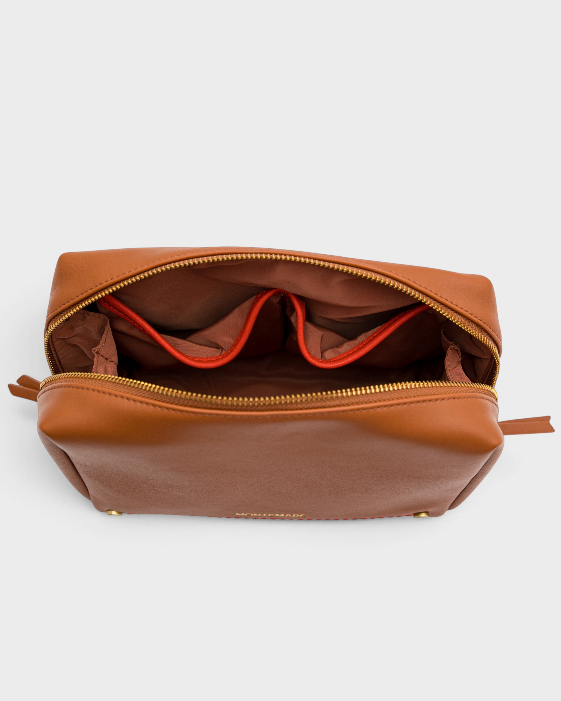 Montemaré Roma standing toiletry case in brown vegan leather with orange interior pocket trim and gold zipper