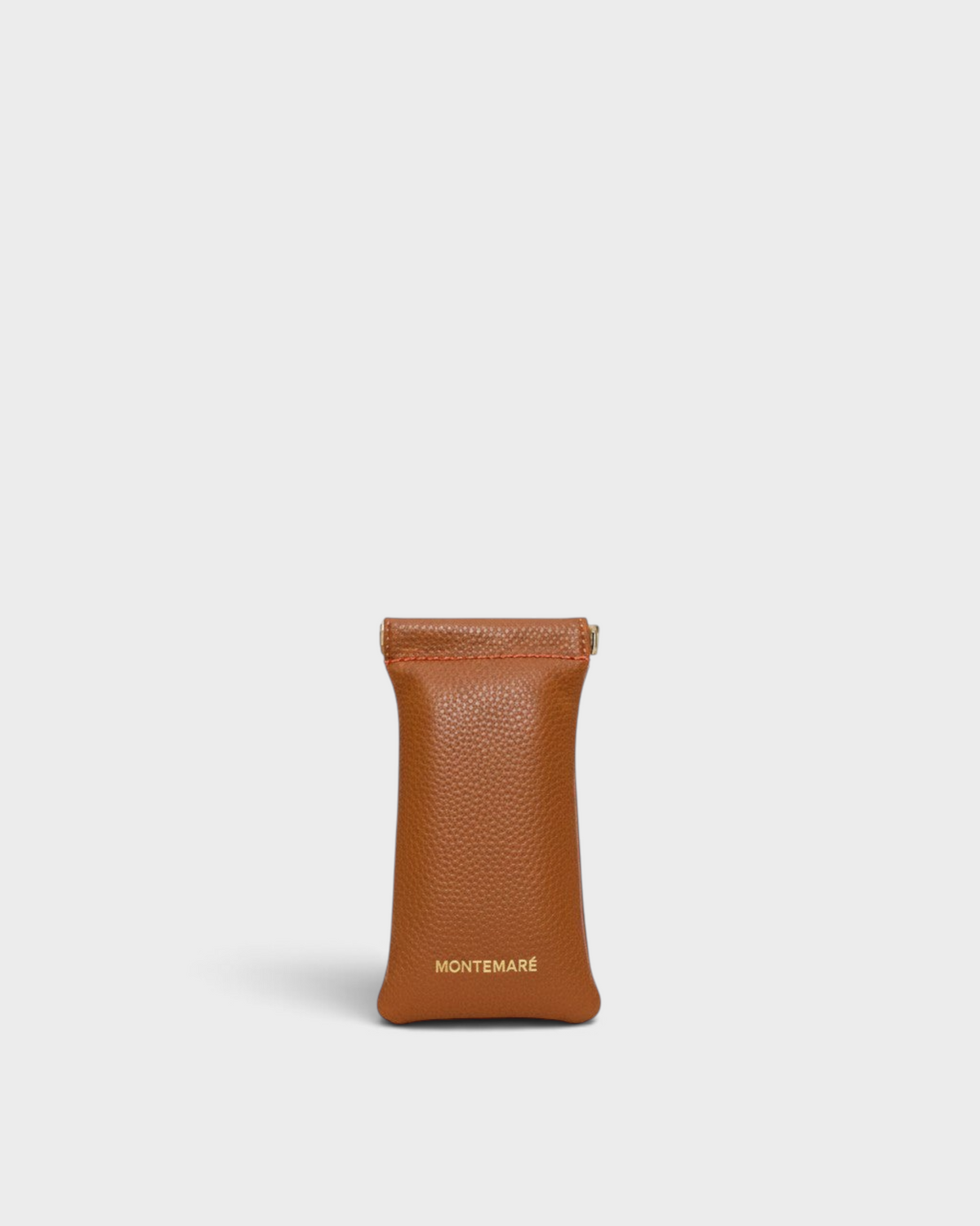 Montemaré Roma glasses case in tan vegan leather with a spring-frame closure and gold logo detail