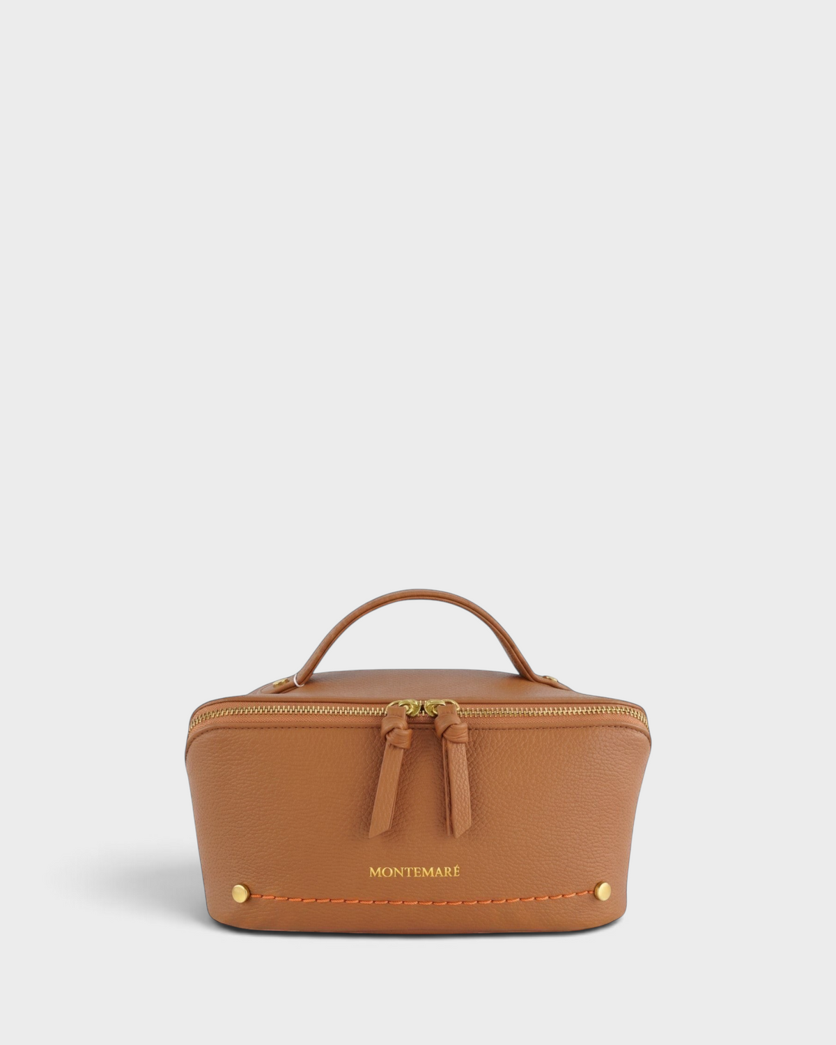 Montemaré Roma foldout toiletry case in tan vegan leather with gold hardware, top handle, and orange stitching.