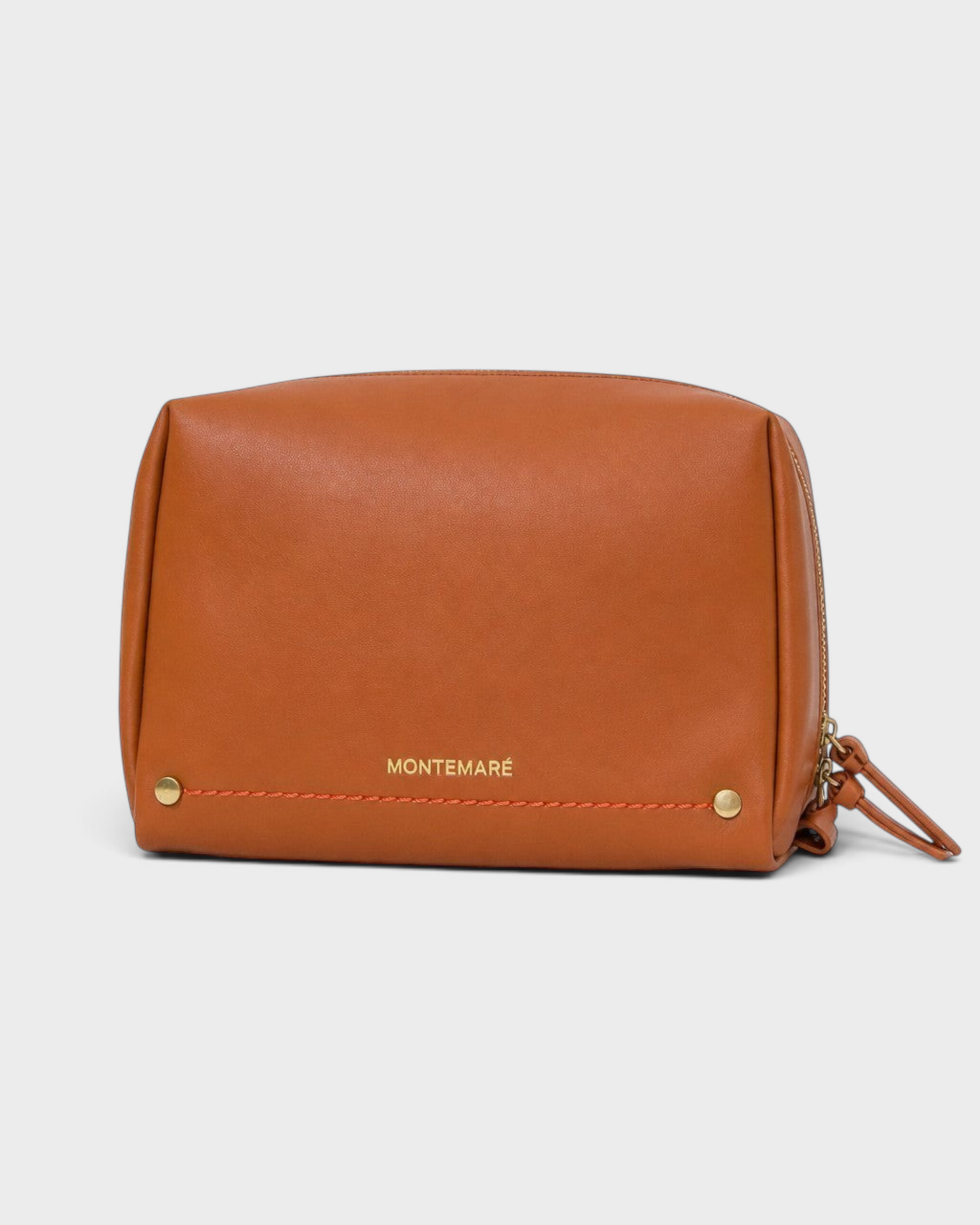 Montemaré Roma standing toiletry case in tan vegan leather with gold hardware and orange stitching details