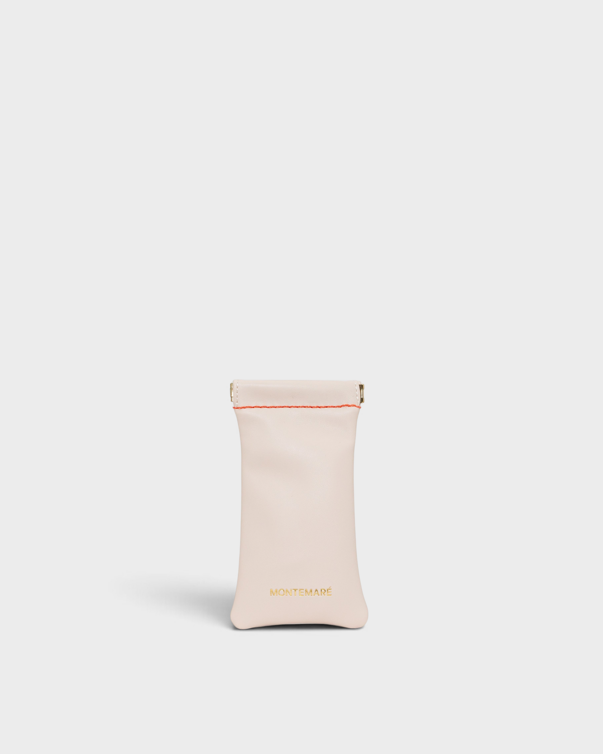 Montemaré Roma glasses case in light beige vegan leather with a spring-frame closure and contrast stitching.