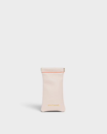 Montemaré Roma glasses case in light beige vegan leather with a spring-frame closure and contrast stitching.
