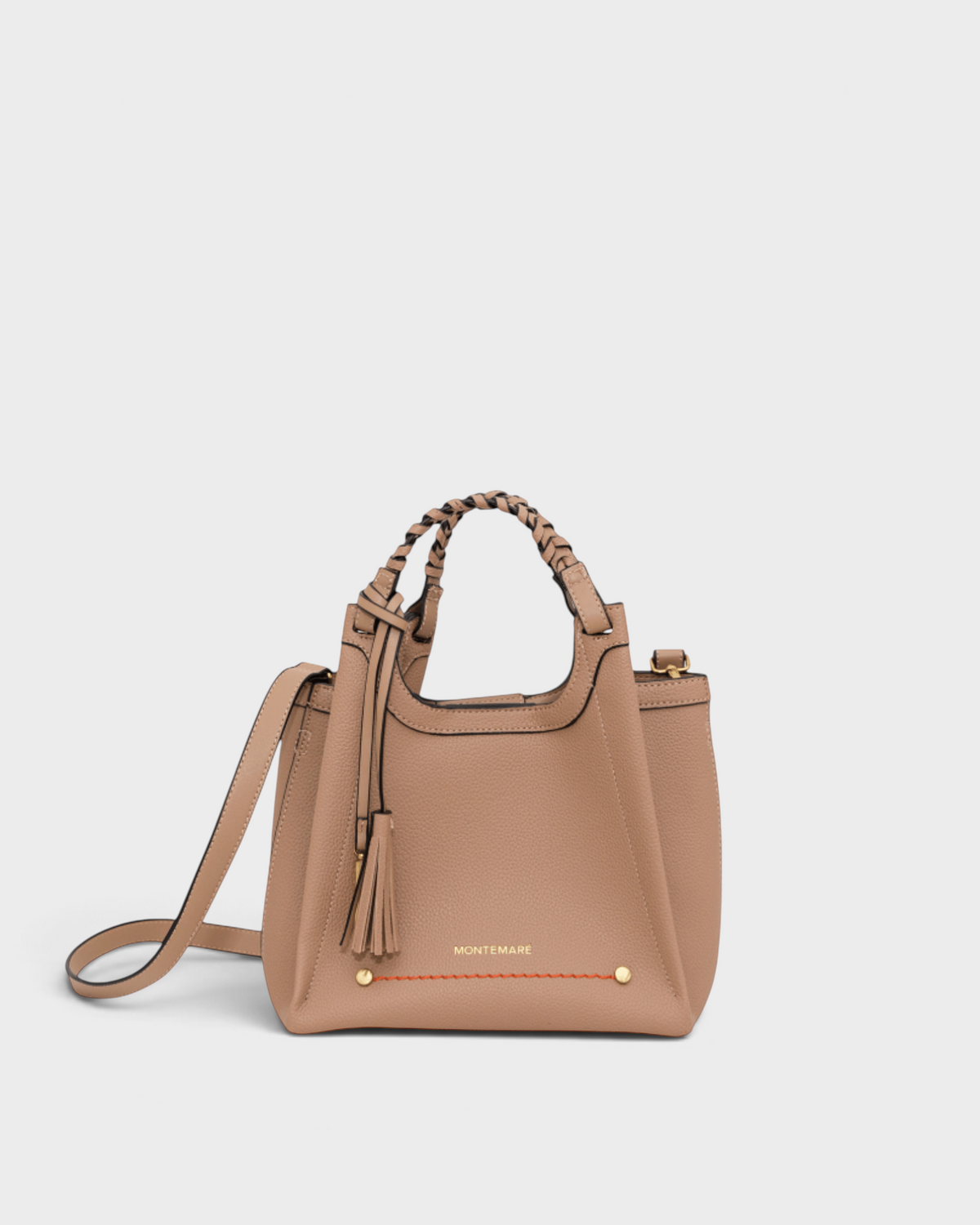 Montemaré Sedona crossbody bag in beige pebbled vegan leather with a braided top handle and signature tassel.