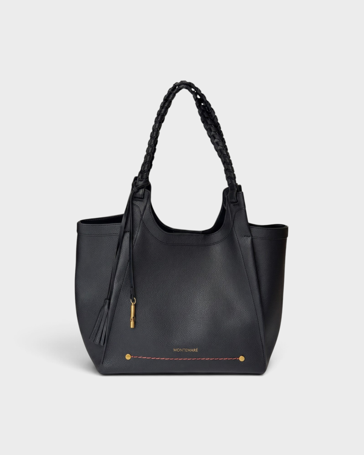 Montemaré Sedona black vegan leather tote bag with hand-braided straps and signature safety whistle tassel.