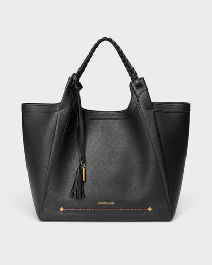 Montemaré Sedona black pebbled vegan leather work tote with hand-braided handles and signature whistle tassel.